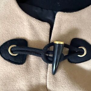 Rachel Zoe Tan and Black Cape